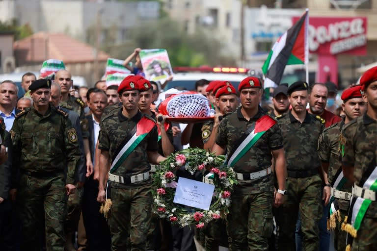 Palestinian security forces carry the body of slain US-Turkish activist Aysenur Ezgi Eygi in Nablus in the occupied West Bank (Jaafar ASHTIYEH)