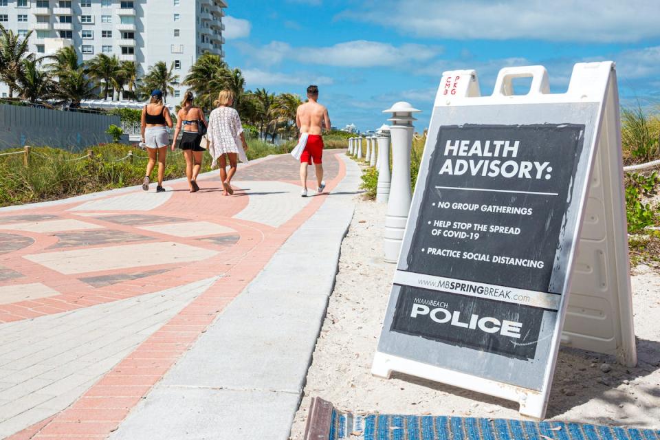 Miami Beach, South Beach, Spring Break closed public beaches sign police warning due to Coronavirus Pandemic