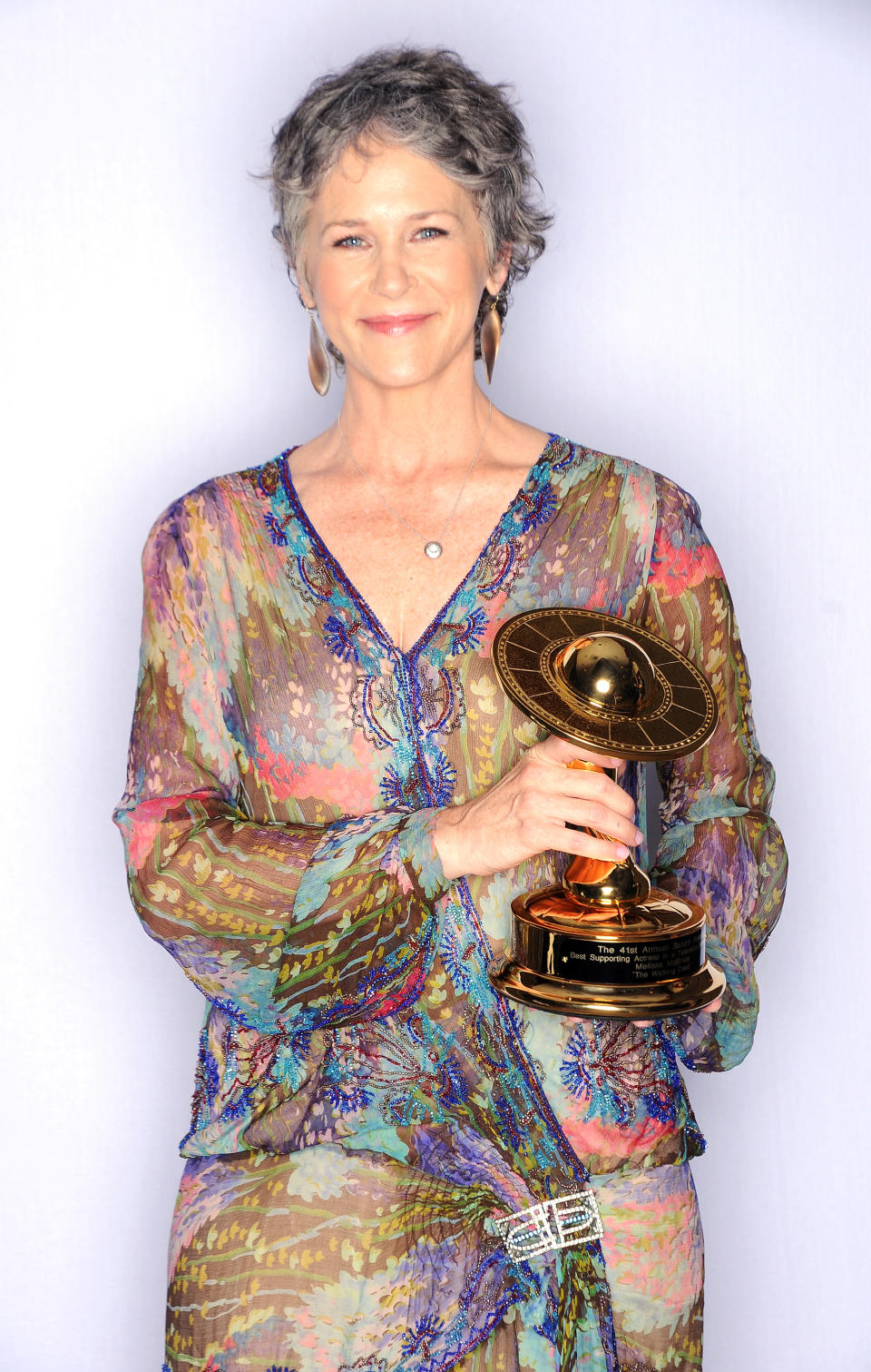 Melissa McBride poses with her award for Best Supporting Actress on Television in AMC’s <i>The Walking Dead</i> at the 41st Annual Saturn Awards on June 25, 2015, in Burbank, Calif. (Photo: Jody Cortes/Getty Images)