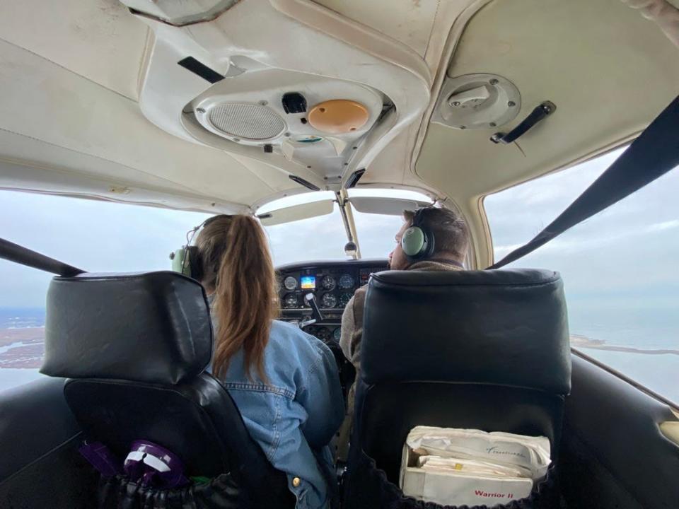 Flying in a tiny airplane.