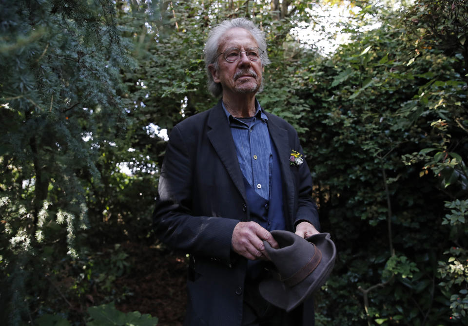 Austrian author Peter Handke poses for a photo in his garden at his house in Chaville near Paris, Thursday, Oct. 10, 2019. Handke was awarded the 2019 Nobel Prize in literature earlier Thursday. (AP Photo/Francois More)