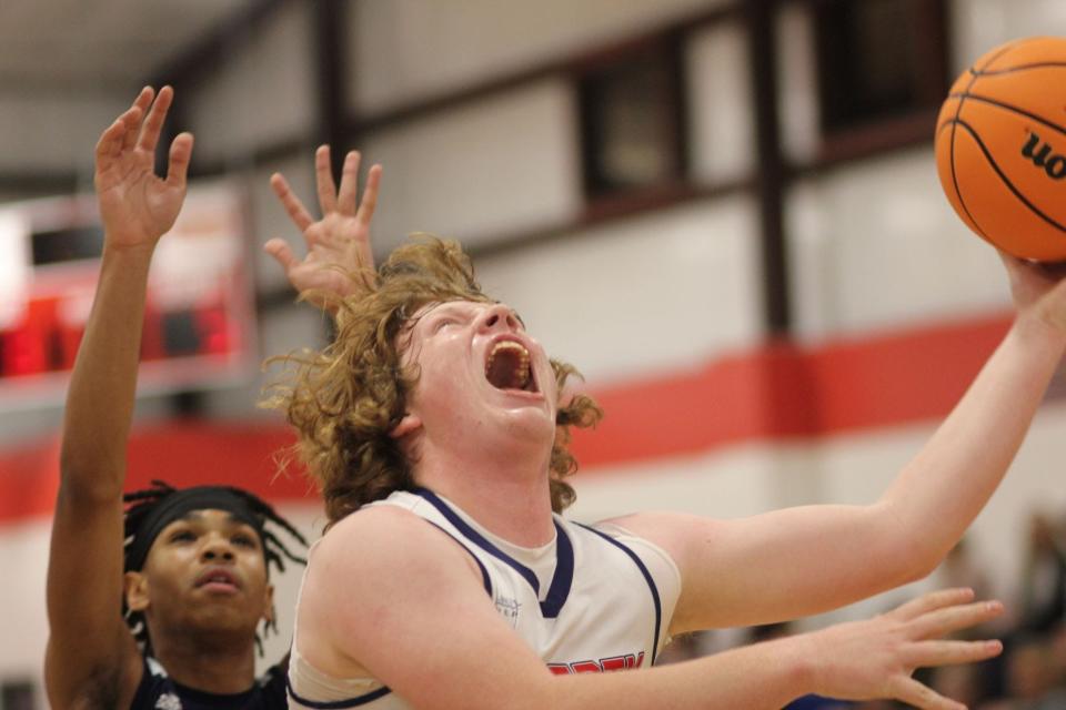 Liberty Christian's Zayne Robinson goes up for a layup Monday night against John Paul II Catholic.