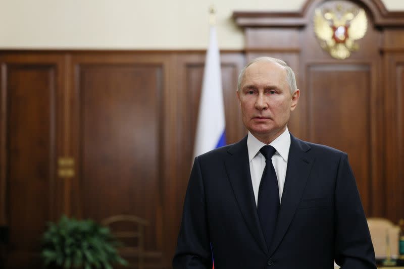 Russian President Vladimir Putin gives a televised address in Moscow