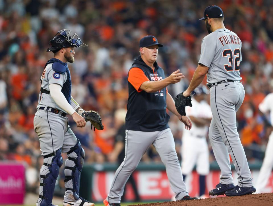 Detroit Tigers manager A.J. Hinch (14) pulls pitcher Michael Fulmer (32) against the Houston Astros in the eighth inning at Minute Maid Park.