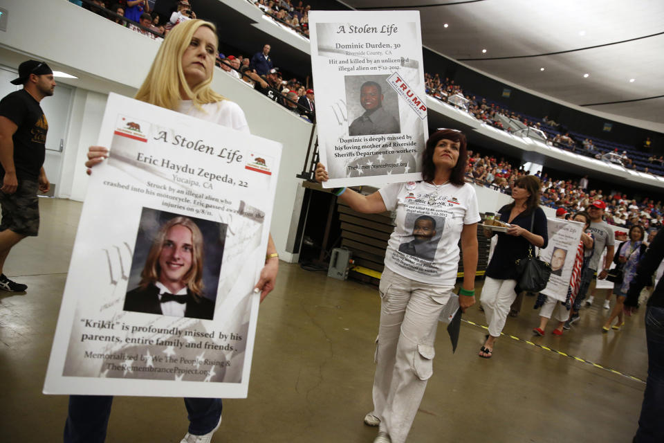 <p>Brenda Sparks, left; Sabine Durden, second from left, and others representing “Stolen Lives” families of people who died in incidents said to be caused by undocumented immigrants take part in a rally with Republican presidential candidate Donald Trump in Anaheim, Calif., May 25, 2016. (Reuters/Jonathan Ernst) </p>