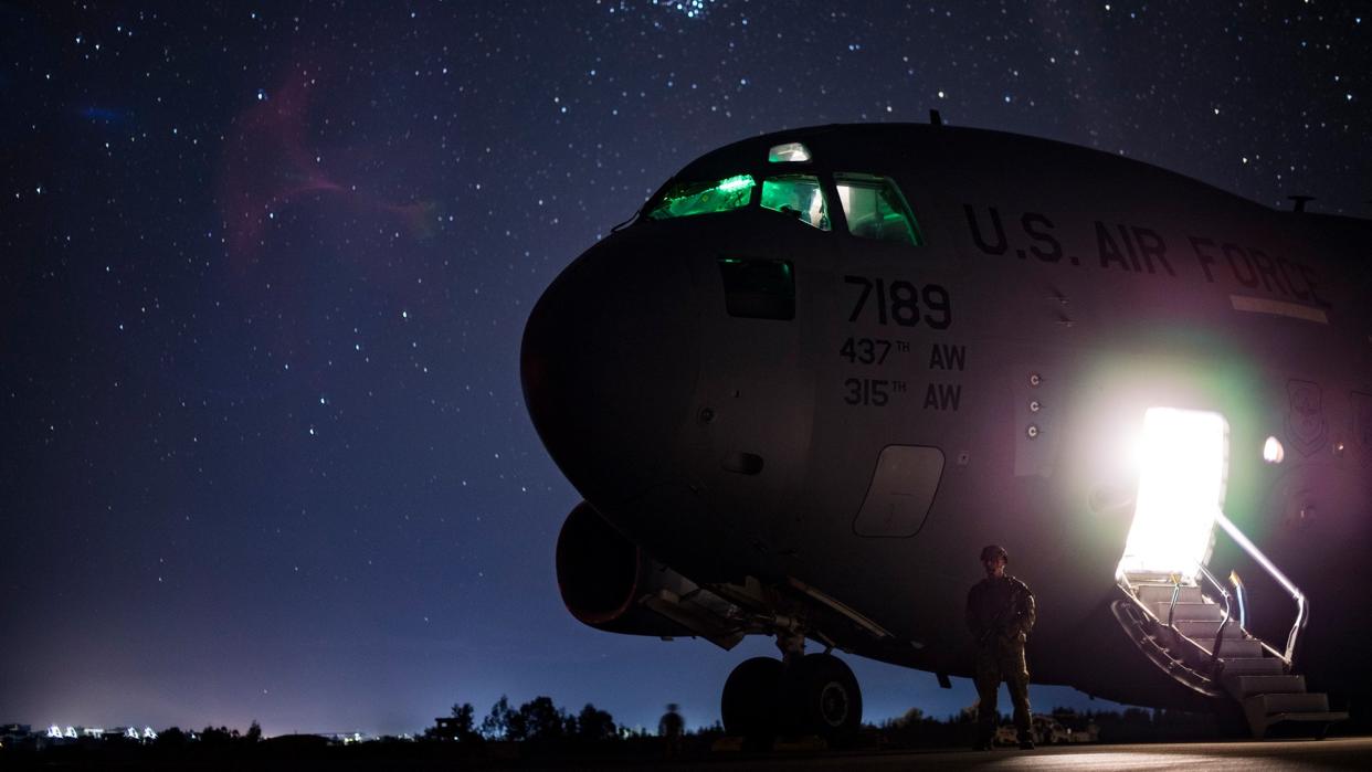 a c-17 aircraft at night