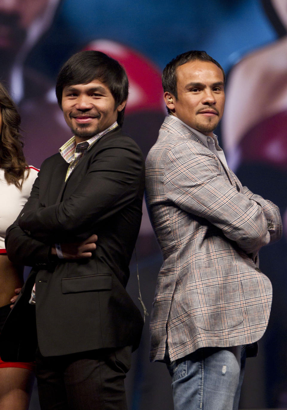 WBO welterweight champion boxer Manny Pacquiao, of the Philippines, left, poses for photos next to his challenger Juan Manuel Marquez, of Mexico, during a news conference in Mexico City, Friday, Sept. 21, 2012. The boxers are promoting their fourth fight, scheduled for Dec. 8, 2012 in Las Vegas. (AP Photo/Christian Palma)