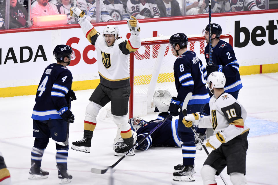 Vegas Golden Knights' William Karlsson (71) celebrates after his goal against Winnipeg Jets' goaltender Connor Hellebuyck (37) during second-period Game 4 NHL Stanley Cup first-round hockey playoff action in Winnipeg, Manitoba, Monday April 24, 2023. (Fred Greenslade/The Canadian Press via AP)