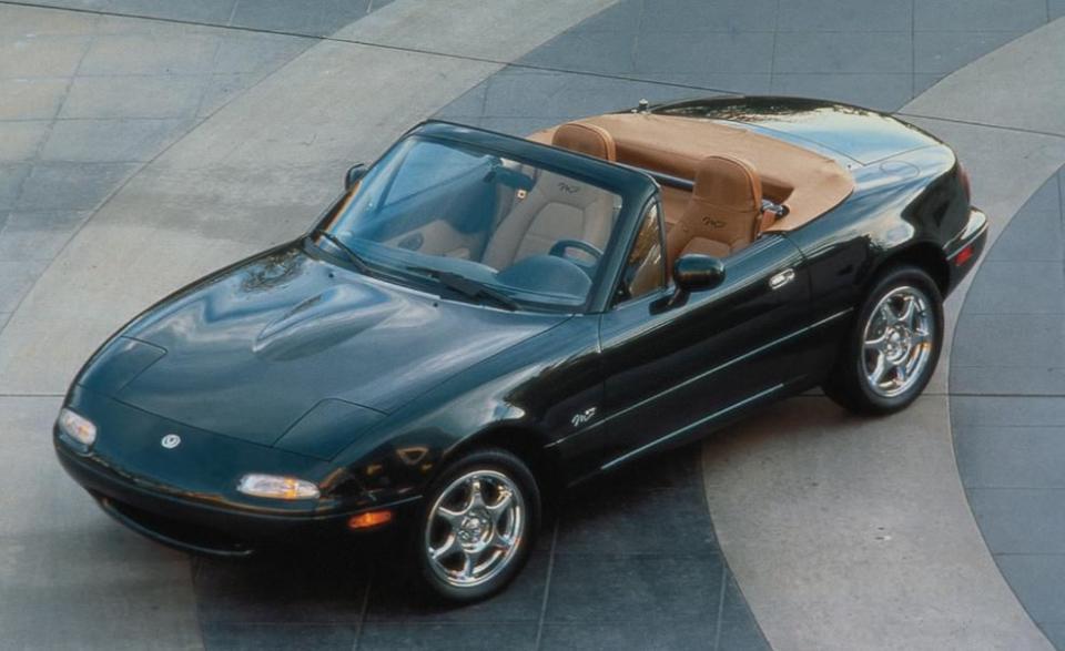 <p>For the first-generation MX-5 Miata's final year before its redesign, Mazda goes all-in on special-edition models, generating two: the STO and another M Edition (pictured here). The former, which stands for "Special Touring Option," has Twilight Blue paint, 15-inch five-spoke Enkei wheels, a tan interior and top, and STO badging. Only 1500 are produced for 1997. As for the latter, the M Edition, it gets Marina Green Mica paint, polished six-spoke wheels, a tan interior and top, Mazda's upgraded audio system with headrest speakers in the seats, and a Nardi wood shift knob<br></p>