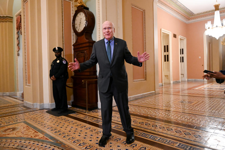 Sen. Leahy gestures to reporters as he walks toward the Senate chamber after a break in the impeachment trial of President Trump