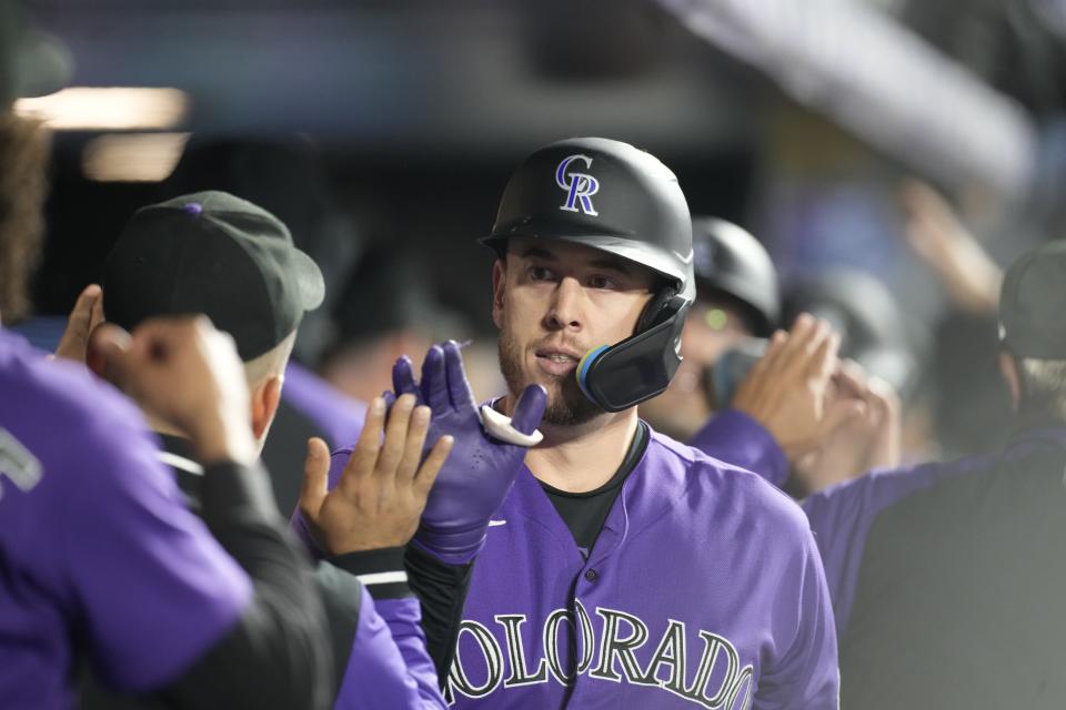 Colorado Rockies first baseman C.J. Cron walks through the dugout during game Saturday, Sept. 10, 2022, in Denver. Cron finished the year driving in a career-high 102 runs and was named an All-Star. | David Zalubowski, Associated Press