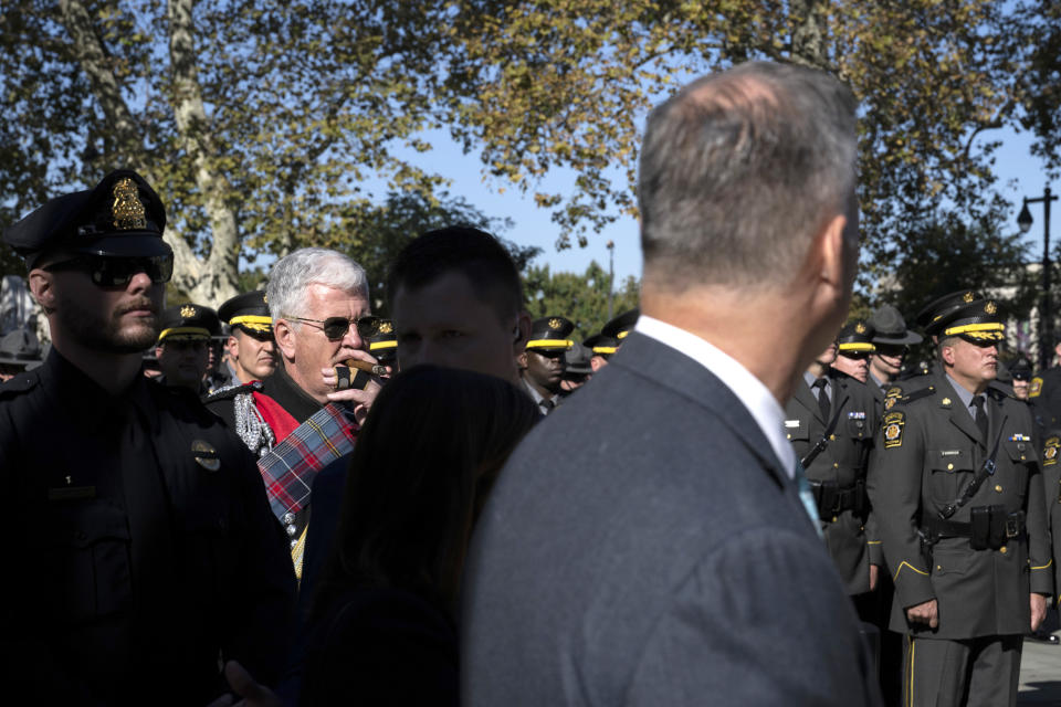 Law enforcement officers gather for a viewing for officer Richard Mendez at the Cathedral Basilica of Saints Peter and Paul in Philadelphia, Tuesday, Oct. 24, 2023. Mendez was shot and killed, and a second officer was wounded when they confronted people breaking into a car at Philadelphia International Airport on Oct. 12, police said. (AP Photo/Joe Lamberti)