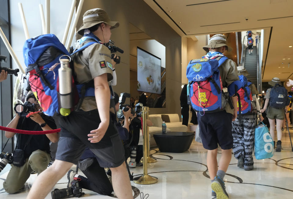 British scout members arrive from the World Scout Jamboree camp site, at a hotel, South Korea, Saturday, Aug. 5, 2023. South Korea is plowing ahead with the World Scout Jamboree, rejecting a call by the world scouting body to cut the event short as a punishing heat wave caused thousands of British and U.S. scouts to begin leaving the coastal campsite Saturday.(AP Photo/Ahn Young-joon)