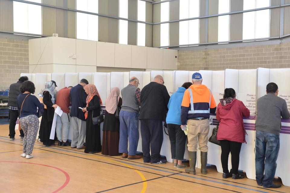 People arrive at a polling station to cast their votes during general elections to elect its parliament and prime minister in Melbourne, Australia on May 18, 2019. (Photo by Recep Sakar/Anadolu Agency/Getty Images)