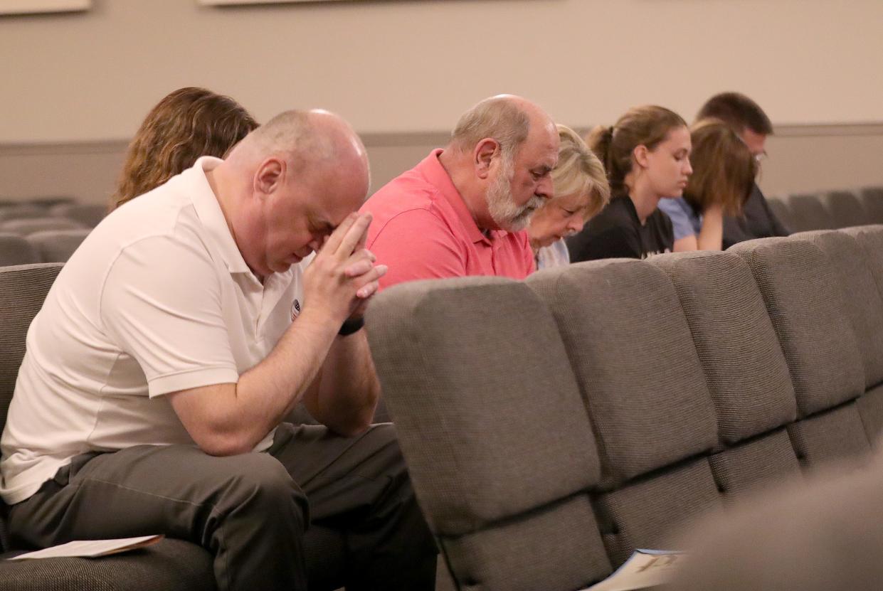 Attendees pray silently Thursday, May 2, 2024, during the National Day of Prayer program at Alliance Christian Center.