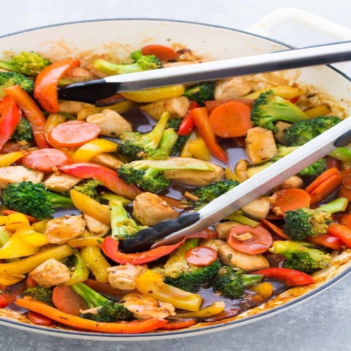 A big pot of chicken and vegetable stir-fry