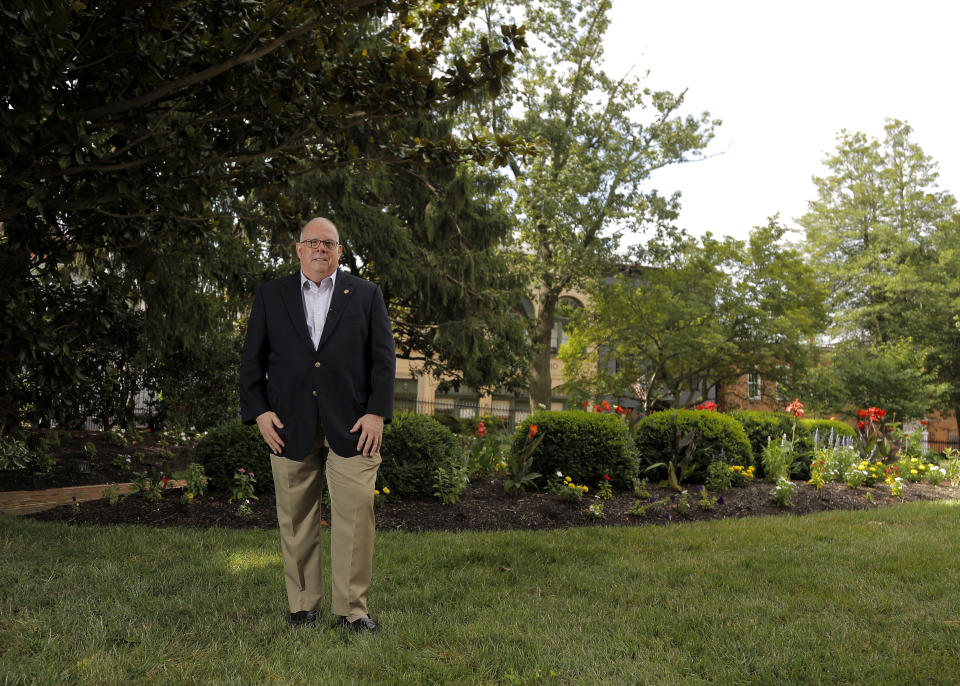 Maryland Gov. Larry Hogan poses for a photograph during an interview with The Associated Press to talk about his response to the coronavirus outbreak as chairman of the National Governors Association, Thursday, July 23, 2020, in Annapolis, Md. Hogan also discussed his book which is expected to be released next week. (AP Photo/Julio Cortez)