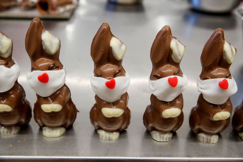 FILE PHOTO: Chocolate Easter bunnies wearing protective masks are seen at Baeckerei Bohnenblust bakery in Bern