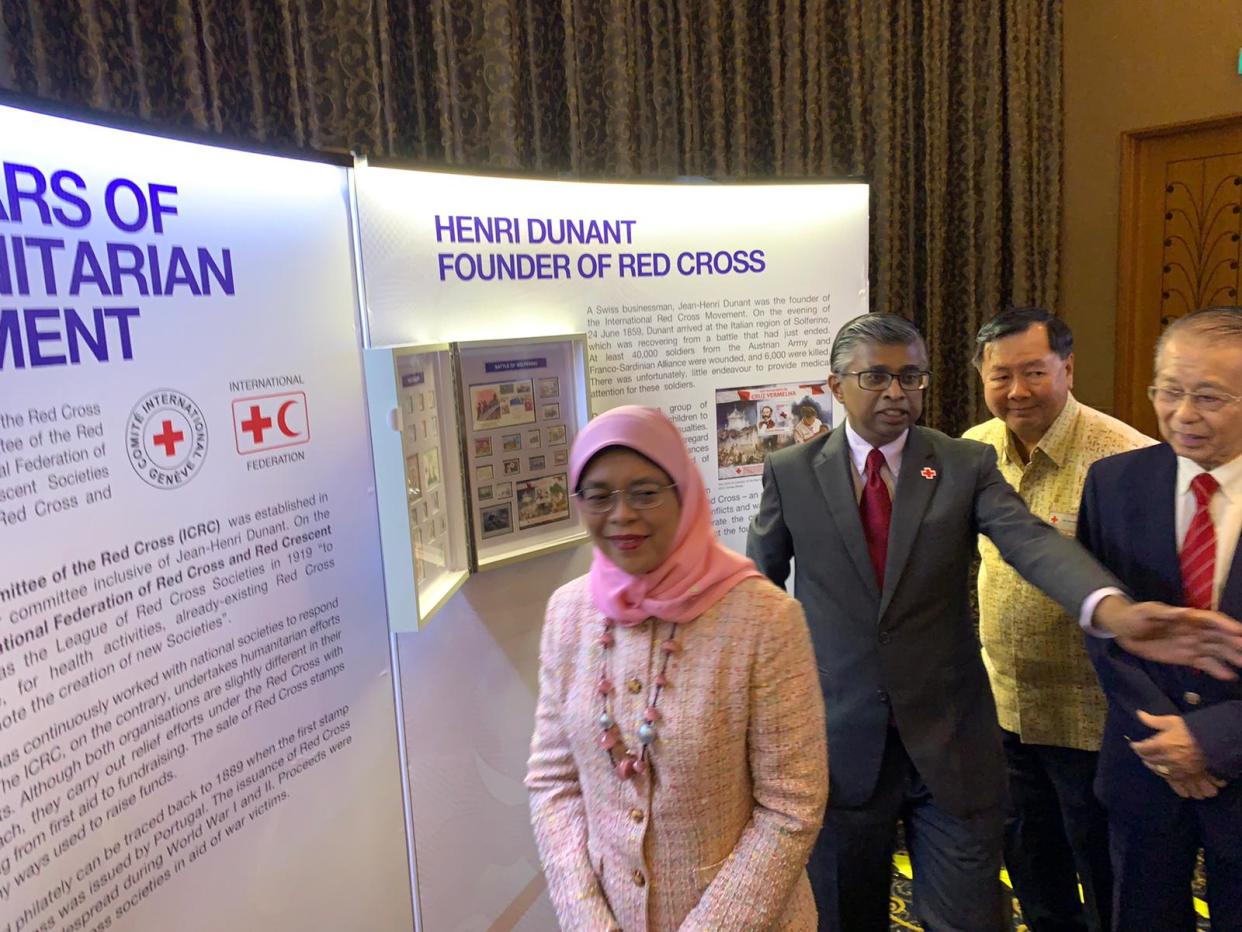 President Halimah Yacob accompanied by Singapore Red Cross Secretary-General Benjamin William (second from left) at the 70th anniversary celebration of the Singapore Red Cross. PHOTO: Nicholas Yong/Yahoo News Singapore 