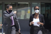 Lawyer Javier Villalba, left and John McAfee's wife Janice leave the Brians 2 penitentiary center in Sant Esteve Sesrovires, near Barcelona, northeast Spain, Friday, June 25, 2021. A judge in northeastern Spain has ordered an autopsy for John McAfee, creator of the McAfee antivirus software, a gun-loving antivirus pioneer, cryptocurrency promoter and occasional politician who died in a cell pending extradition to the United States for allegedly evading millions in unpaid taxes. McAfee's Spanish lawyer, Javier Villalba, said the entrepreneur's death had come as a surprise to his wife and other relatives, since McAfee "had not said goodbye." (AP Photo/Joan Mateu)