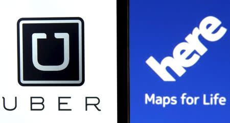 Uber logo is seen on a smartphone in front of a displayed logo of HERE, Nokia Oyj's map business, in Zenica, Bosnia and Herzegovina, in this May 8, 2015 photo illustration. REUTERS/Dado Ruvic