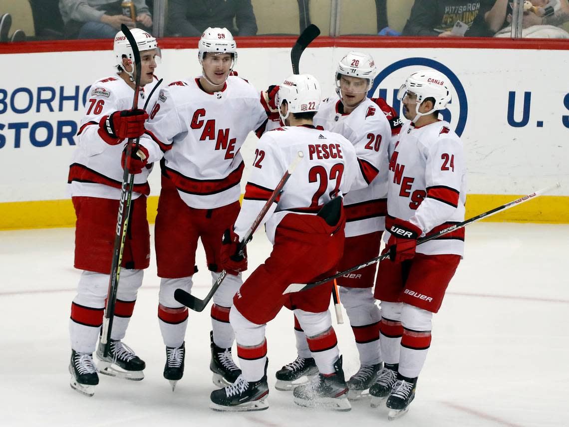 Carolina Hurricanes center Martin Necas (second from left) celebrates his goal with teammates defensemen Brady Skjei (76) and Brett Pesce (22) and forwards Sebastian Aho (20) and Seth Jarvis (24) against the Pittsburgh Penguins during the second period at PPG Paints Arena in November 2022.