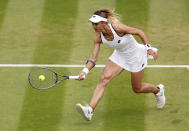 Ukraine's Lesia Tsurenko returns to Britain's Jodie Burrage during a women's singles first round match on day one of the Wimbledon tennis championships in London, Monday, June 27, 2022. (Steve Paston/PA via AP)