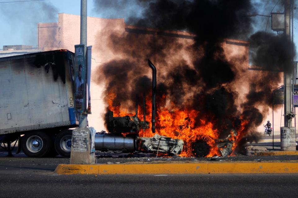 A truck burns on a street in Culiacan, Sinaloa state, on Thursday. Mexican security forces captured Ovidio Guzmán, an alleged drug trafficker wanted by the United States and one of the sons of former Sinaloa cartel boss Joaquín “El Chapo” Guzmán, in a pre-dawn operation.