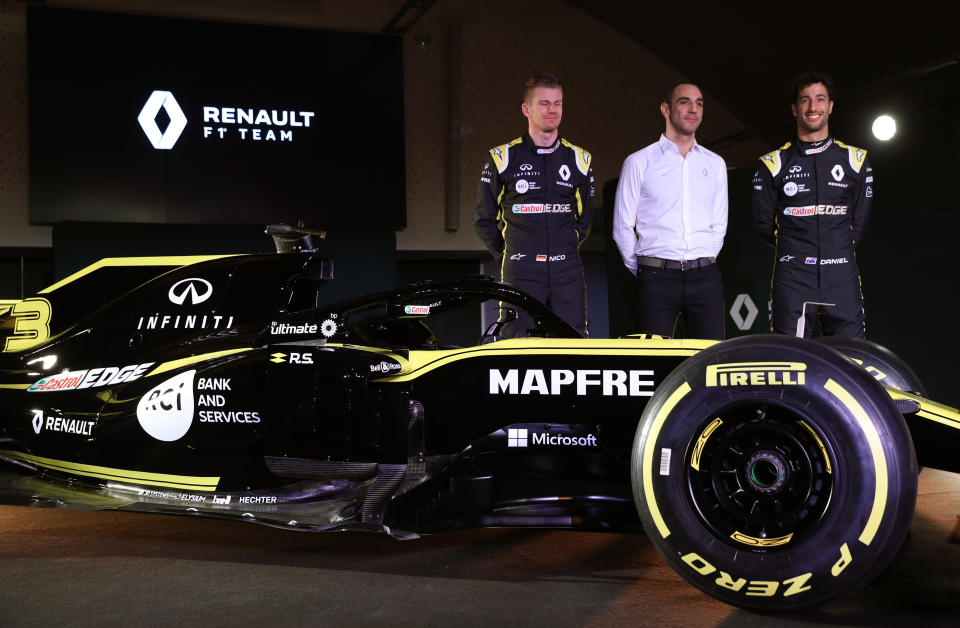 Drivers Niko Hulkenberg (left) and Daniel Ricciardo with Renault Managing Director Cyril Abiteboul during the Renault F1 Team 2019 season launch at Whiteways Technical Centre, Oxford. (Photo by Andrew Matthews/PA Images via Getty Images)