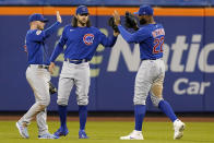 From left to right, Chicago Cubs outfielder Ian Happ, center fielder Jake Marisnick and right fielder Jayson Heyward celebrate after their victory over the New York Mets in a baseball game, Thursday, June 17, 2021, in New York. (AP Photo/Kathy Willens)