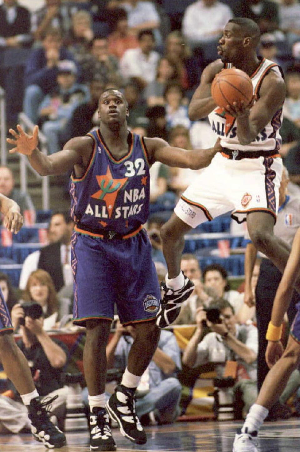 Eastern Conference All-Star Shaquille O'Neal tries to stop the drive to the hoop of the Western Conference's Shawn Kemp of the Seattle Supersonics, February 12, 1995. (Eric DROTTER/AFP/Getty Images)