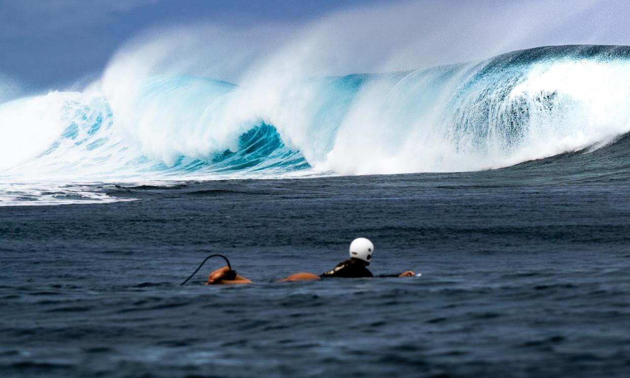 <span>An olympic athlete rides the waves in Teahupo’o, Tahiti</span><span>Photograph: Atea Lee Chip Sao/The Guardian</span>