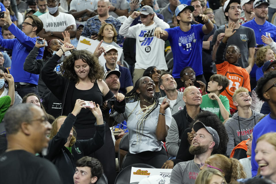 Fans cheer the Duke practice for the men's Final Four NCAA college basketball tournament, Friday, April 1, 2022, in New Orleans. (AP Photo/Gerald Herbert)