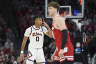 Illinois guard Terrence Shannon Jr. (0) gestures near Wisconsin guard Max Klesmit after making a 3-point basket during the second half of an NCAA college basketball game in the championship of the Big Ten Conference tournament, Sunday, March 17, 2024, in Minneapolis. (AP Photo/Abbie Parr)