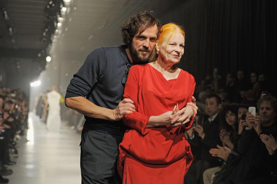 PARIS, FRANCE - MARCH 02: Fashion designer Vivienne Westwood (R) and Andreas Kronthaler acknowledge applause following Westwood's Fall/Winter 2013 Ready-to-Wear show as part of Paris Fashion Week on March 2, 2013 in Paris, France. (Photo by Pascal Le Segretain/Getty Images)