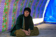 A displaced woman, who fled a village controlled by Islamic State militants, sits inside her tent at the refugee camp in Hammam Ali, south of Mosul, Iraq February 24, 2017. REUTERS/Alaa Al-Marjani