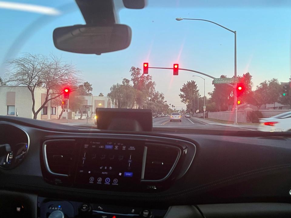 The Waymo car at a red light.