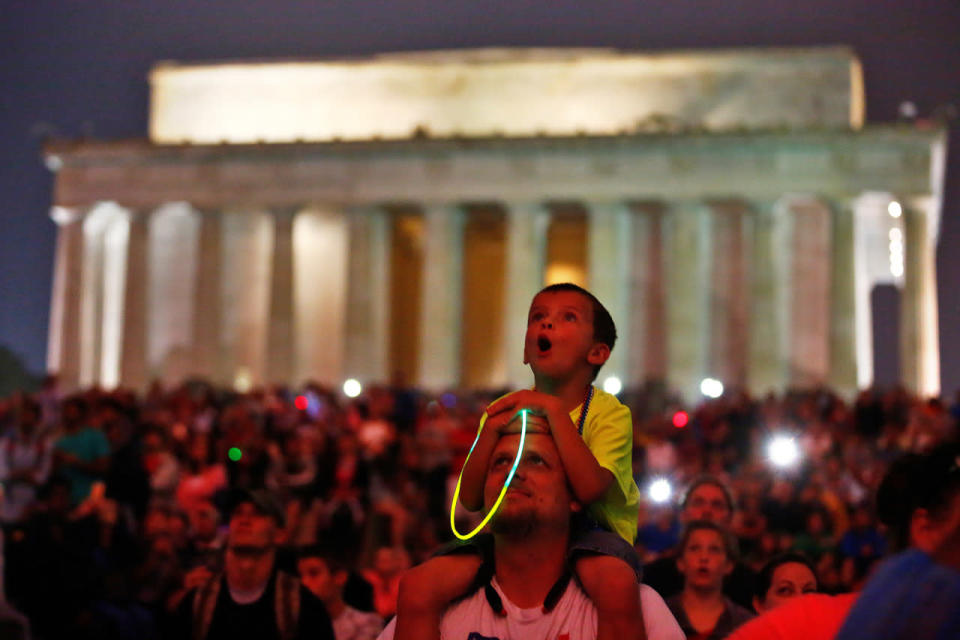 A child reacts as he watches fireworks during the 4th of July Independence Day celebrations at the National Mall in Washington, U.S.