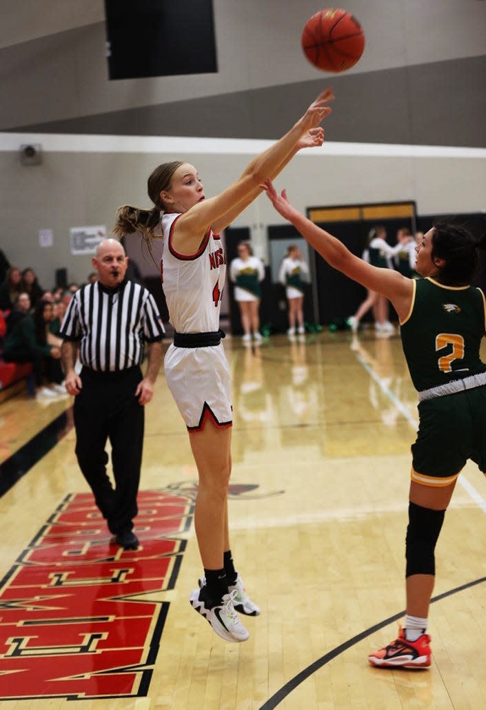 Kennedy Petersen fires a 3-pointer during the Roland-Story girls' 52-42 victory over Saydel Dec. 13 in Story City.