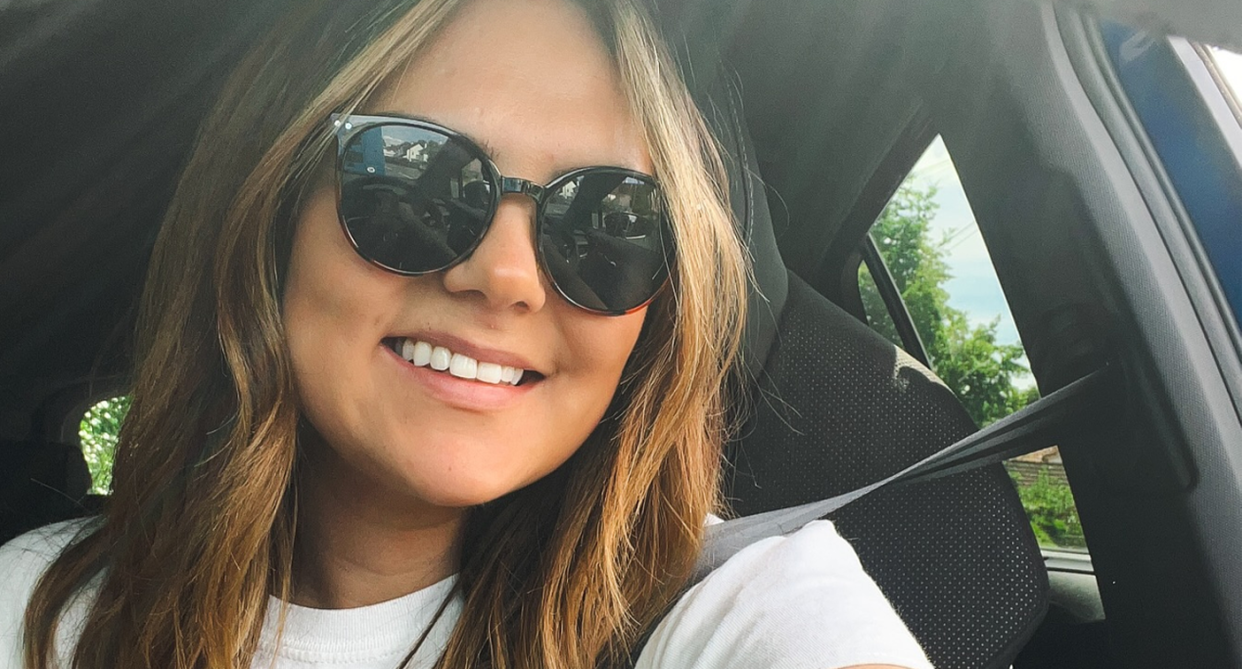 Steph Robinson pictured behind the wheel of her electric car.