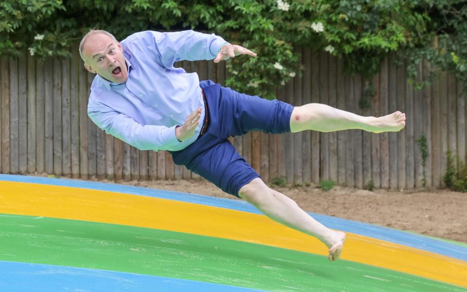 Sir Ed Davey bounces on a trampoline in Surrey