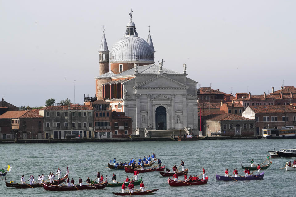 Gondoliers wait for the arrival of Pope Francis in front of the Santissimo Redentore church in Venice, Sunday, April 28, 2024. The Pontiff arrived for his first-ever visit to the lagoon town including the Vatican pavilion at the 60th Biennal of Arts. (AP Photo/Alessandra Tarantino)