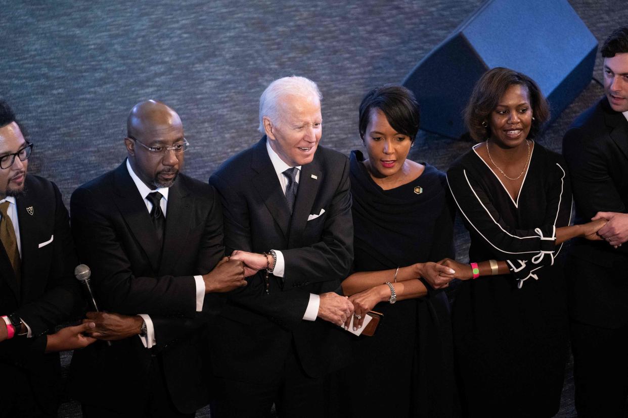 President Joe Biden sings "We Shall Overcome" during a Jan. 15, 2023, service at Atlanta's Ebenezer Baptist Church. Biden has claimed that he was once arrested while protesting in support of civil rights.