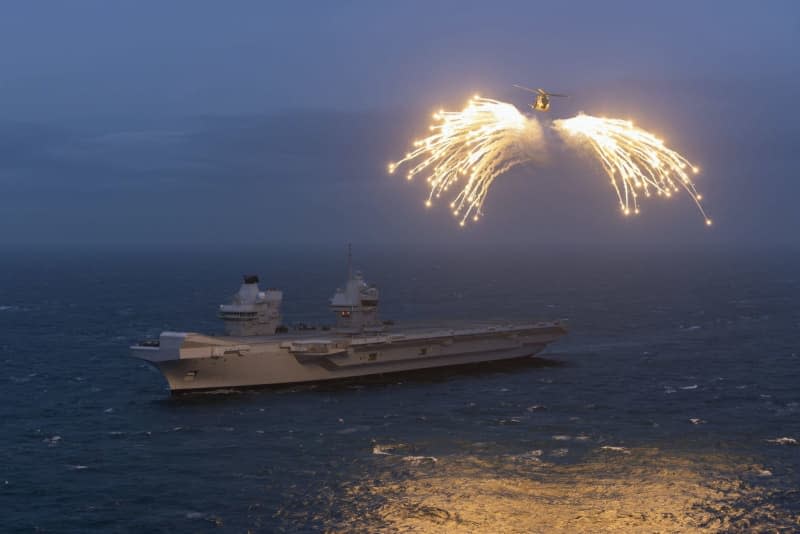 An Undated handout photo made available on 29 February by the British Ministry of Defence, shows a Merlin helicopter from 820 Naval Air Squadron loading and firing flares from HMS Prince of Wales during the Exercise steadfast Defender. Lphot Stuart Dickson/PA Media/dpa