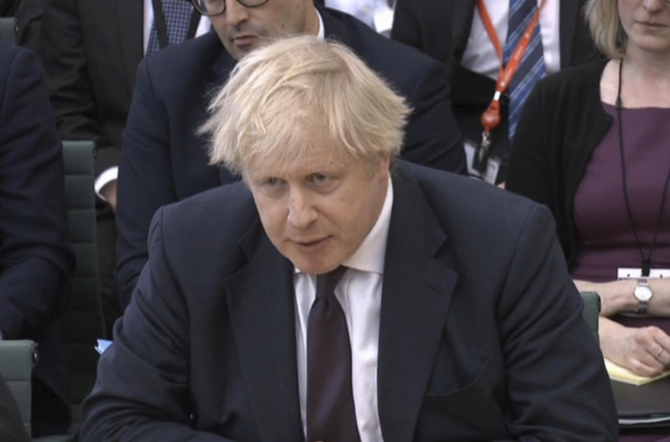 Foreign Secretary Boris Johnson gives evidence to the House of Commons Foreign Affairs Committee in Portcullis House, London Wednesday March 21, 2018. Johnson said Russia carried out a nerve-agent attack on British soil because the U.K. has “time and again called out Russia over its abuses” of human rights and democratic values. (PA via AP)