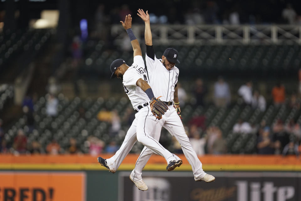 Detroit Tigers' Willi Castro, left, and Harold Castro, right, celebrate after the final out in the ninth inning of a baseball game against the Chicago White Sox in Detroit, Monday, Sept. 20, 2021. Detroit won 4-3. (AP Photo/Paul Sancya)