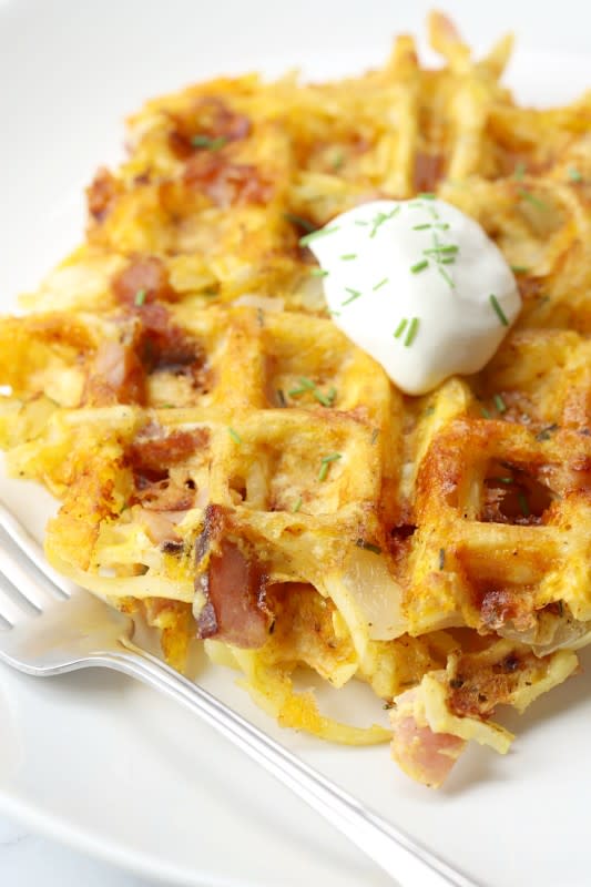 <p>The Toasty Kitchen</p><p>Shredded hash browns, ham, eggs and cheese are cooked in a waffle iron, making this savory all-in-one breakfast.</p><p><strong>Get the recipe: <a href="https://thetoastykitchen.com/ham-egg-cheese-hash-brown-waffles/" rel="nofollow noopener" target="_blank" data-ylk="slk:Ham and Cheese Hash Brown Waffles;elm:context_link;itc:0;sec:content-canvas" class="link rapid-noclick-resp">Ham and Cheese Hash Brown Waffles</a></strong></p>