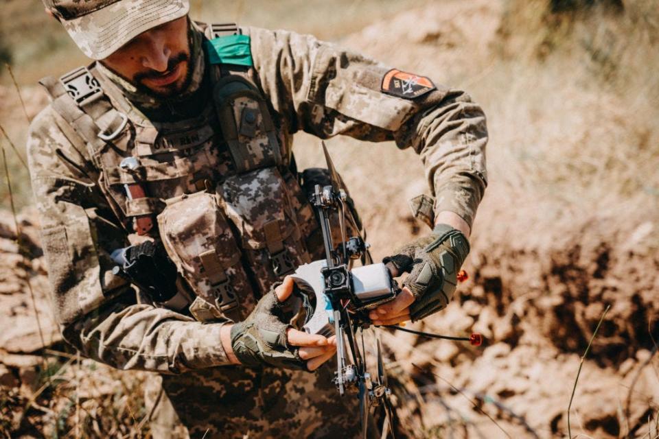 A Ukrainian drone operator from the 24th Separate Mechanized Brigade holds a drone during the testing of new military equipment including FPV drones on the training area amid Russia-Ukraine war in Donetsk Oblast, Ukraine on August 03, 2023.