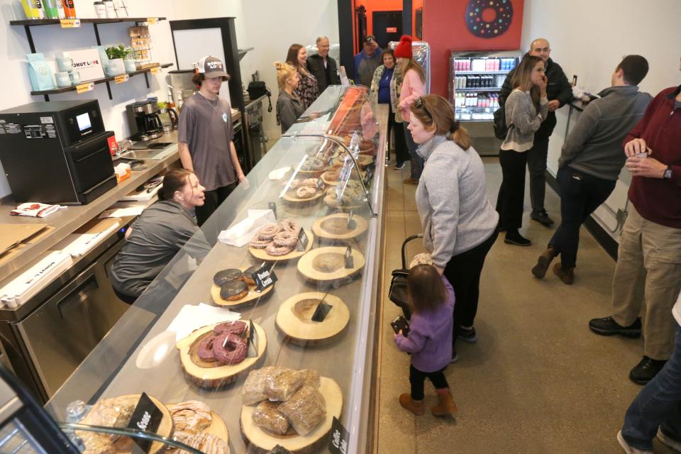 Customers line up for donuts at the grand opening of Donut Love’s third location in Newmarket on Feb. 27, 2024.