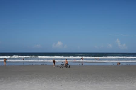 Beachgoers are seen ahead of the arrival of Hurricane Dorian in Daytona Beach